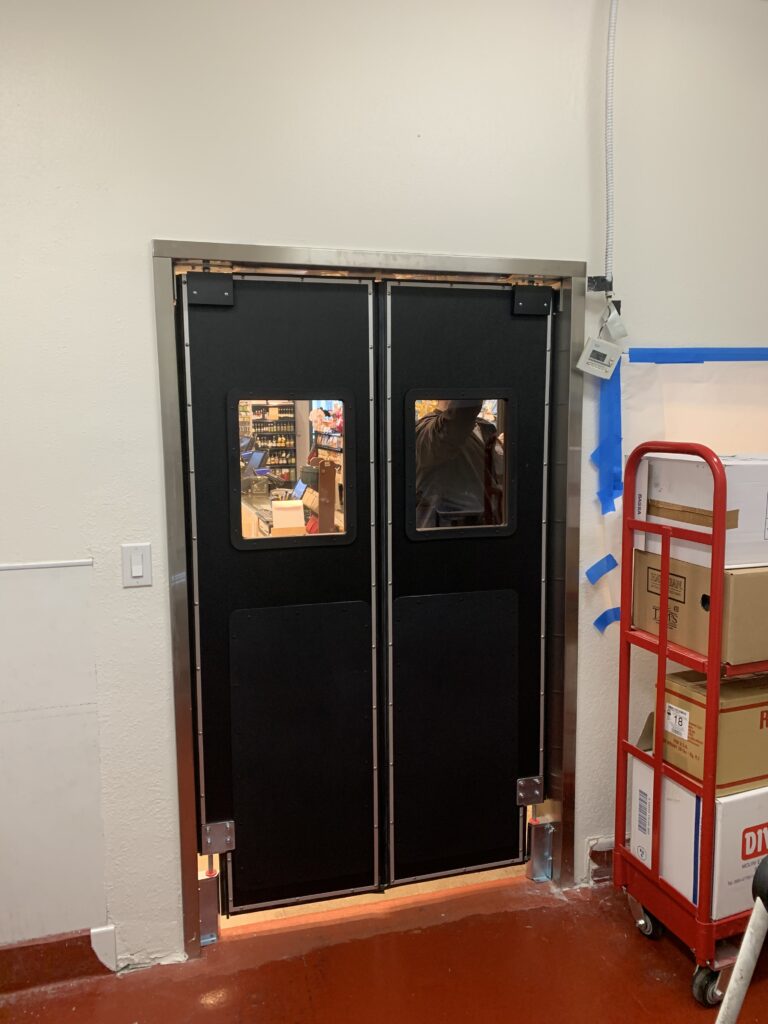 Black double doors with windows